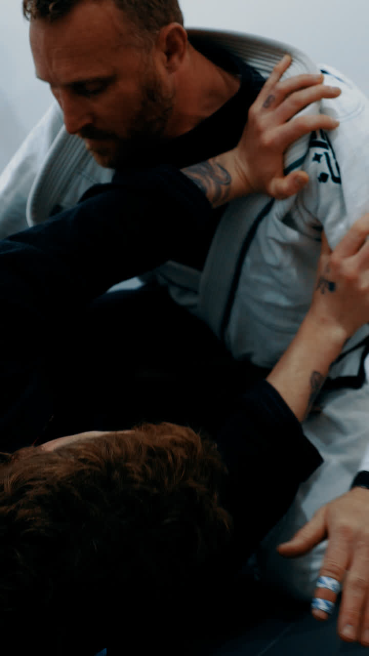 Close-up of two members grappling in the gi