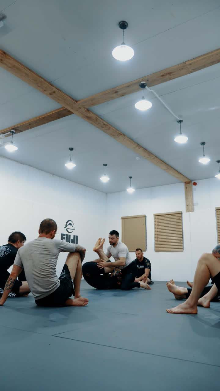 Instructor demonstrating a technique to a seated class